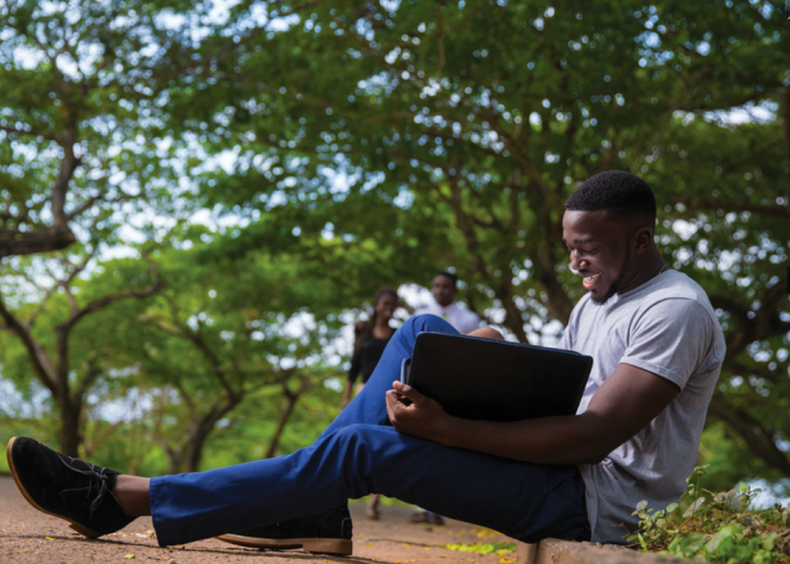 A student studying on the floor